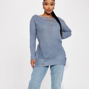 Distressed light blue sweater